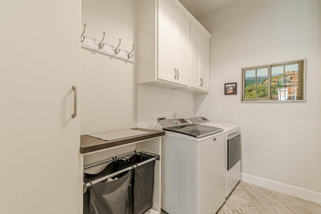 305 Dashing Sycamore St, San Marcos, TX 78666 - washroom with cabinet space, washing machine and dryer, and baseboards