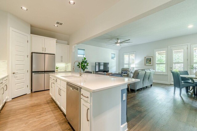 305 Dashing Sycamore St, San Marcos, TX 78666 - kitchen featuring stainless steel appliances, a sink, light wood-type flooring, recessed lighting, and a ceiling fan