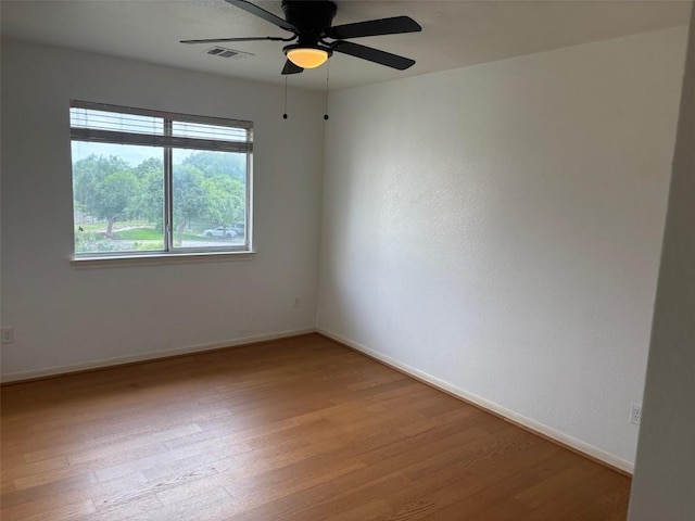 15114 Wells Port Dr, Austin, TX 78728 - empty room with wood finished floors and ceiling fan