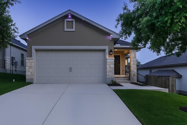 233 Mcfarland St, Georgetown, TX 78628 - ranch-style house with stone siding, stucco siding, driveway, a front yard, and an attached garage