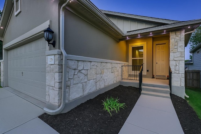233 Mcfarland St, Georgetown, TX 78628 - entrance to property with stone siding, board and batten siding, stucco siding, and an attached garage