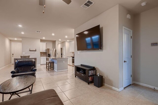 233 Mcfarland St, Georgetown, TX 78628 - living area featuring light tile patterned floors, recessed lighting, baseboards, and ceiling fan