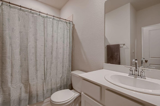 233 Mcfarland St, Georgetown, TX 78628 - full bathroom with toilet, vanity, a textured wall, and curtained shower