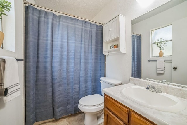 409 Mountain Laurel Dr, Cedar Park, TX 78613 - full bathroom featuring vanity, toilet, tile patterned flooring, a textured ceiling, and curtained shower