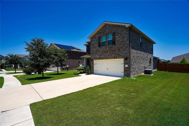 2207 Land Grant Way, Round Rock, TX 78664 - view of home's exterior featuring brick siding, a garage, and driveway
