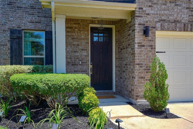 2207 Land Grant Way, Round Rock, TX 78664 - entrance to property featuring brick siding and an attached garage