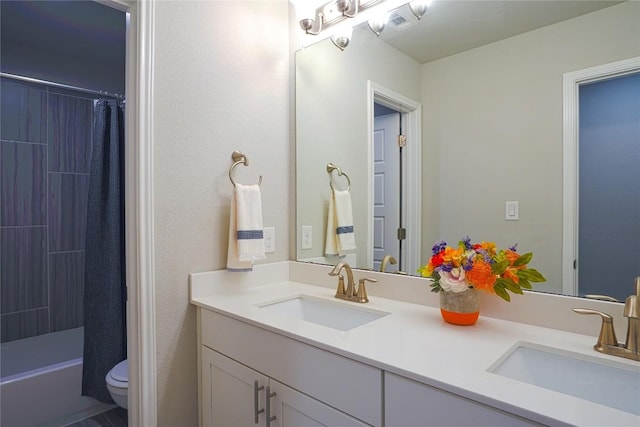 2207 Land Grant Way, Round Rock, TX 78664 - full bath with double vanity and shower / bathtub combination with curtain