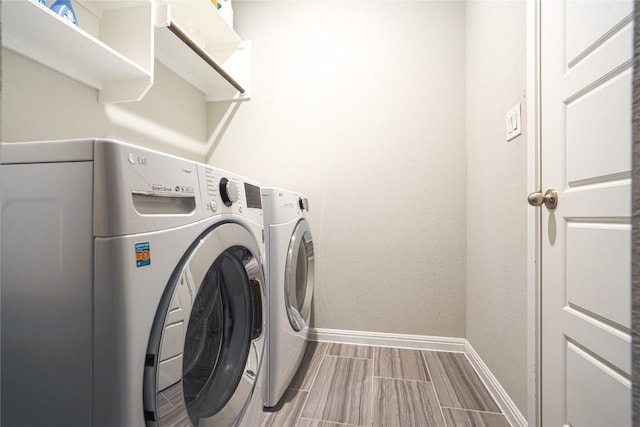 2207 Land Grant Way, Round Rock, TX 78664 - laundry room with separate washer and dryer and wood tiled floors