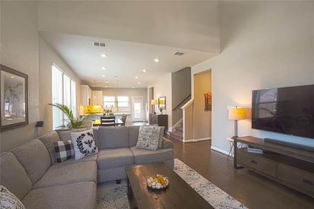 2207 Land Grant Way, Round Rock, TX 78664 - living area with dark wood-type flooring, stairs, and recessed lighting