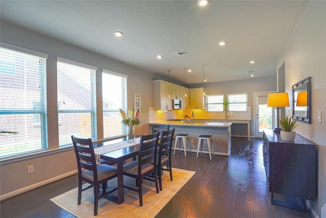 2207 Land Grant Way, Round Rock, TX 78664 - dining area featuring wood finished floors and recessed lighting