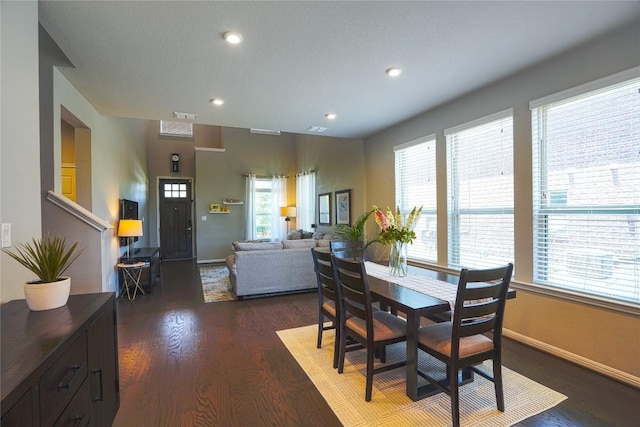 2207 Land Grant Way, Round Rock, TX 78664 - dining area featuring plenty of natural light, wood finished floors, and recessed lighting