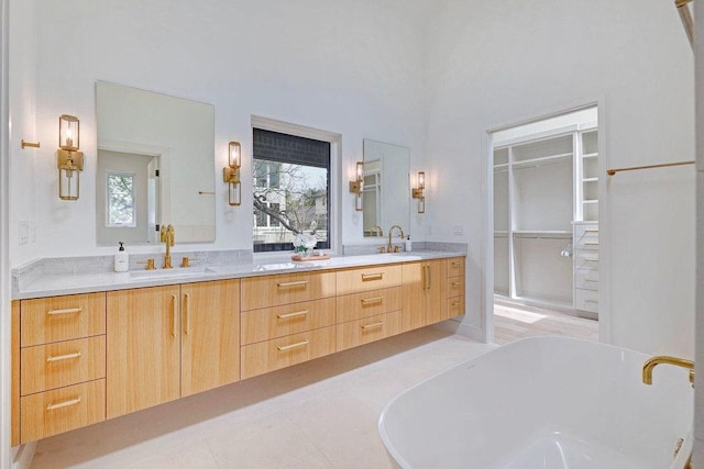 1601 Woodlawn Blvd, Austin, TX 78703 - bathroom with a freestanding tub, double vanity, plenty of natural light, and tile patterned flooring
