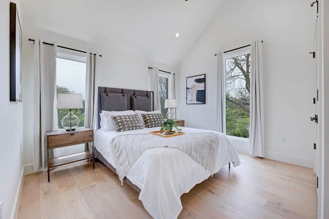 1601 Woodlawn Blvd, Austin, TX 78703 - bedroom with light wood-style flooring, baseboards, and high vaulted ceiling