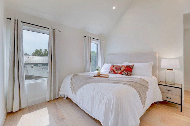 1601 Woodlawn Blvd, Austin, TX 78703 - bedroom featuring light wood finished floors and lofted ceiling