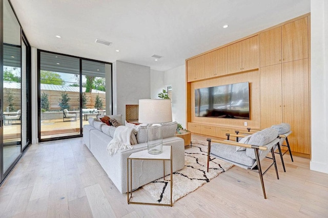 1601 Woodlawn Blvd, Austin, TX 78703 - living area with a wall of windows, light wood-type flooring, and recessed lighting