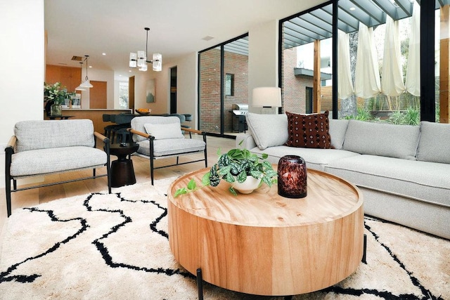 1601 Woodlawn Blvd, Austin, TX 78703 - living room with wood finished floors and a chandelier