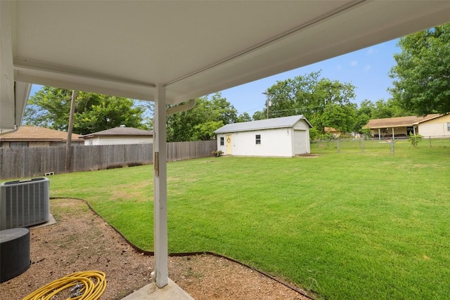 506 S Main St, Thrall, TX 76578 - view of yard featuring cooling unit and an outbuilding
