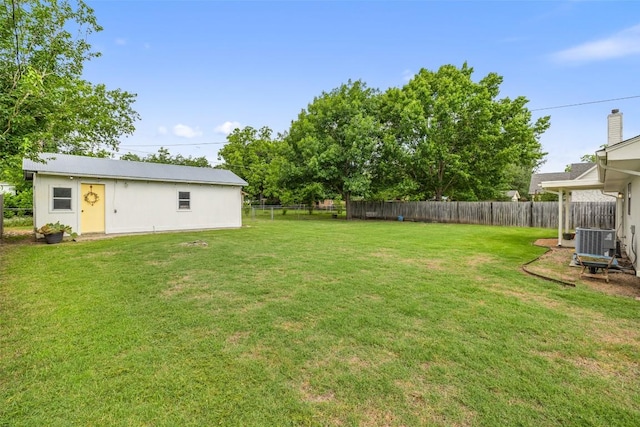 506 S Main St, Thrall, TX 76578 - view of yard featuring cooling unit and an outbuilding