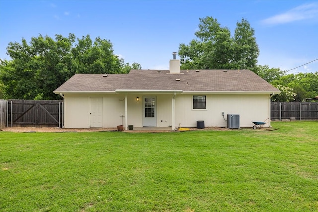 506 S Main St, Thrall, TX 76578 - back of property featuring central AC unit, a chimney, and a gate