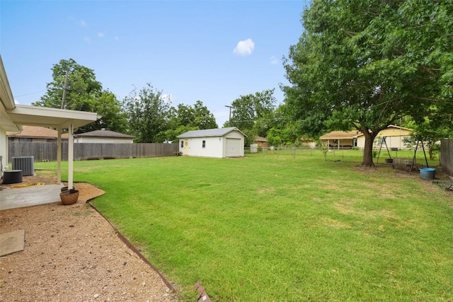 506 S Main St, Thrall, TX 76578 - view of yard featuring central air condition unit and an outdoor structure