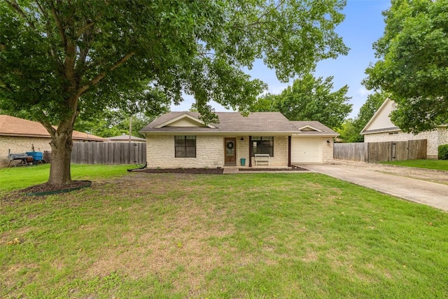 506 S Main St, Thrall, TX 76578 - ranch-style house with concrete driveway, an attached garage, and stone siding