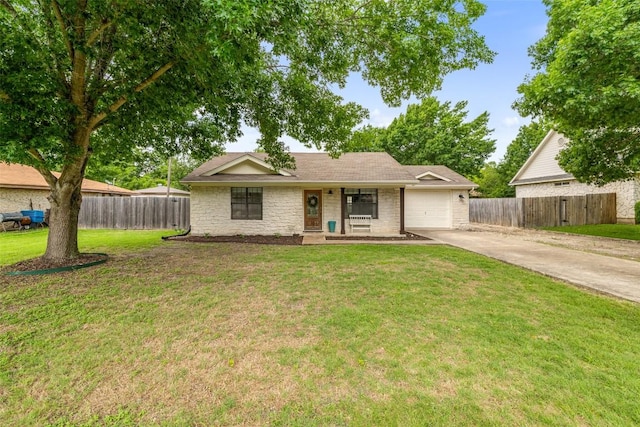 506 S Main St, Thrall, TX 76578 - ranch-style home featuring driveway, stone siding, and an attached garage