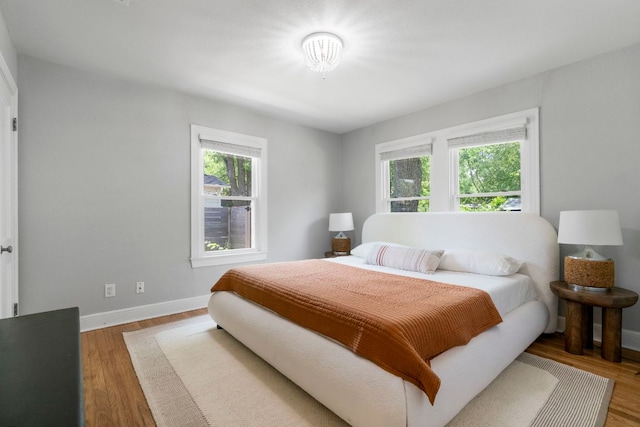 1505 Palo Duro Rd, Austin, TX 78757 - bedroom with baseboards and wood finished floors