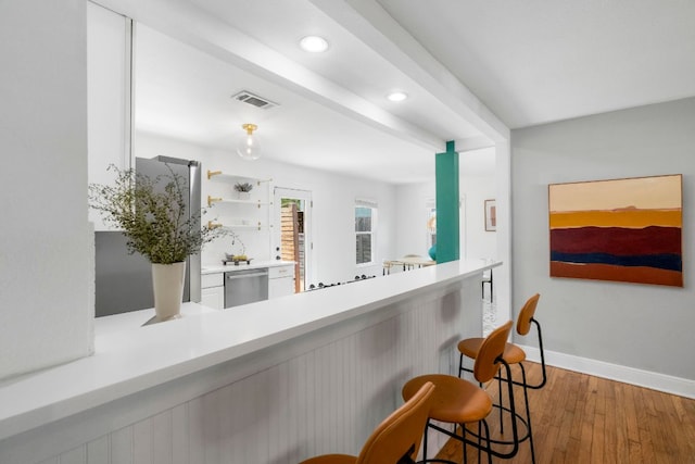 1505 Palo Duro Rd, Austin, TX 78757 - bar area with stainless steel dishwasher, wood finished floors, baseboards, and recessed lighting