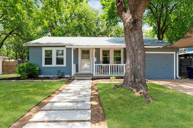 1505 Palo Duro Rd, Austin, TX 78757 - view of front of property featuring covered porch, an attached garage, metal roof, and driveway