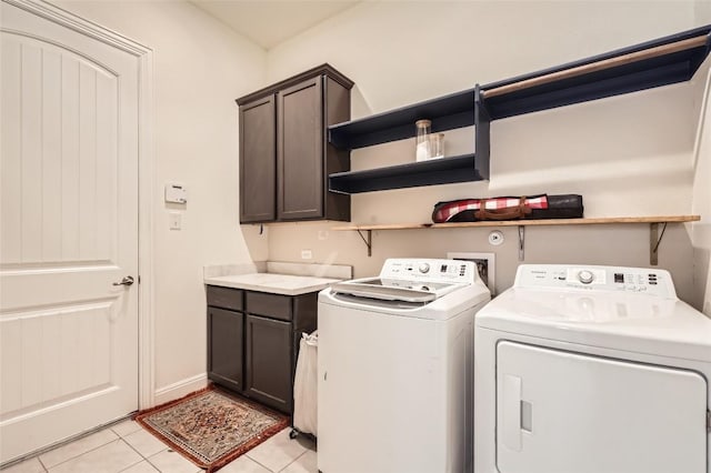 4116 Brean Down Rd, Pflugerville, TX 78660 - laundry area with washing machine and dryer, cabinet space, and light tile patterned flooring