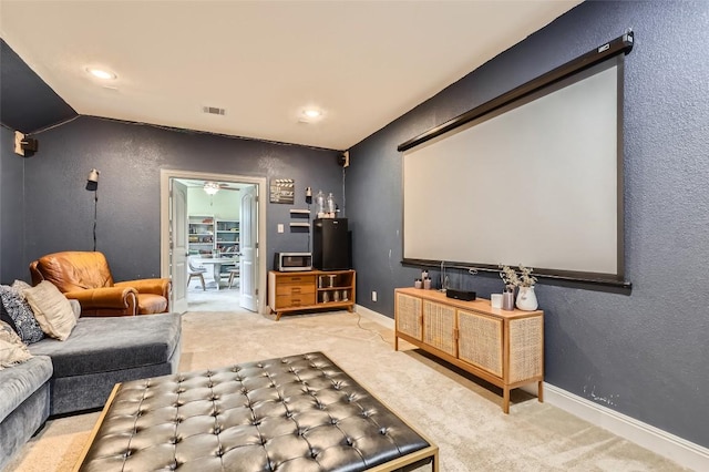 4116 Brean Down Rd, Pflugerville, TX 78660 - carpeted home theater featuring baseboards, lofted ceiling, and recessed lighting