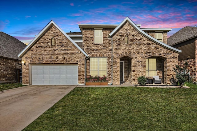 4116 Brean Down Rd, Pflugerville, TX 78660 - view of front of property featuring concrete driveway, a lawn, brick siding, and a garage