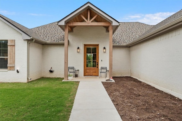 332 Claremont Dr, Belton, TX 76513 - doorway to property featuring a shingled roof, brick siding, and a lawn