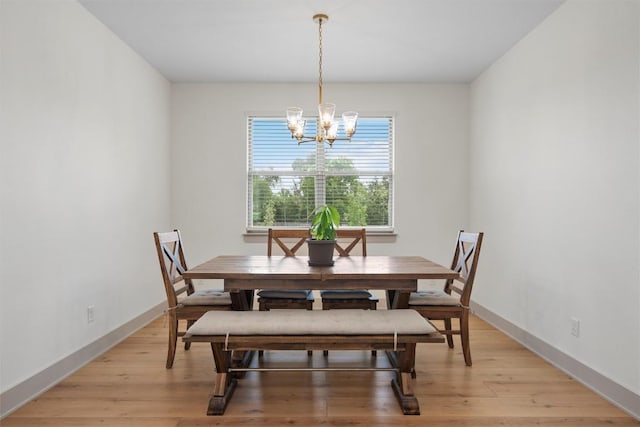 332 Claremont Dr, Belton, TX 76513 - dining area with a chandelier, light wood-style flooring, and baseboards
