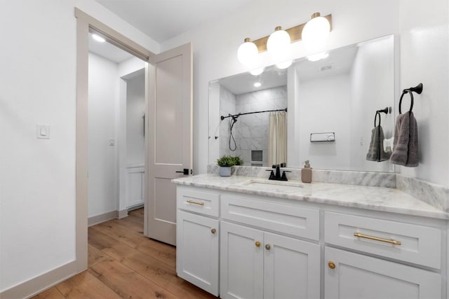 332 Claremont Dr, Belton, TX 76513 - full bath with vanity, wood finished floors, tiled shower, and baseboards