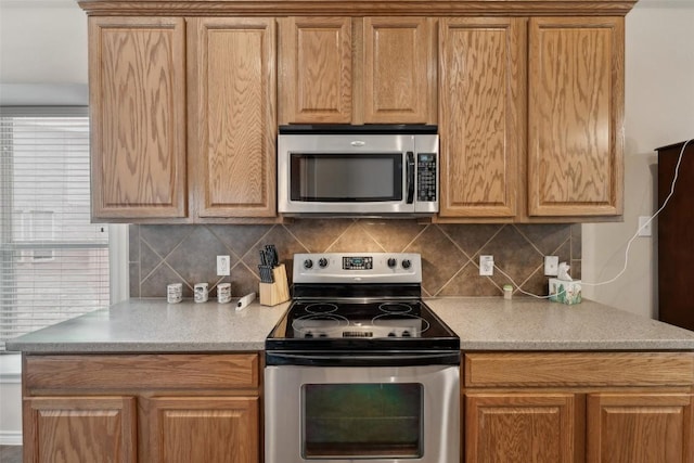 722 Tom Kite Dr, Round Rock, TX 78664 - kitchen with appliances with stainless steel finishes, backsplash, and light countertops