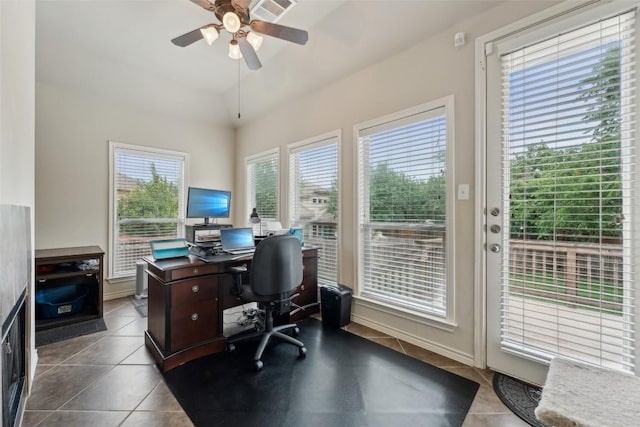 722 Tom Kite Dr, Round Rock, TX 78664 - home office with dark tile patterned floors, a ceiling fan, and lofted ceiling