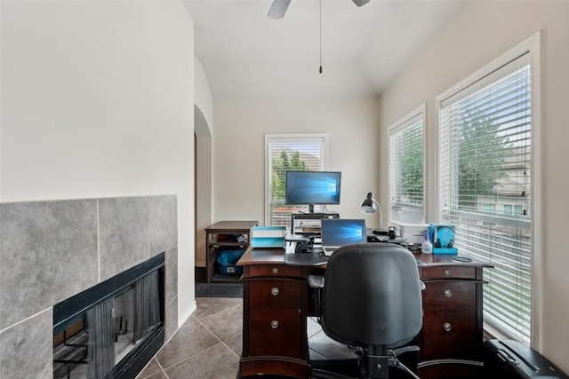 722 Tom Kite Dr, Round Rock, TX 78664 - tiled office with a tiled fireplace, a ceiling fan, and vaulted ceiling