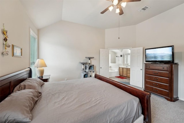 722 Tom Kite Dr, Round Rock, TX 78664 - bedroom with light colored carpet, vaulted ceiling, ensuite bath, and ceiling fan
