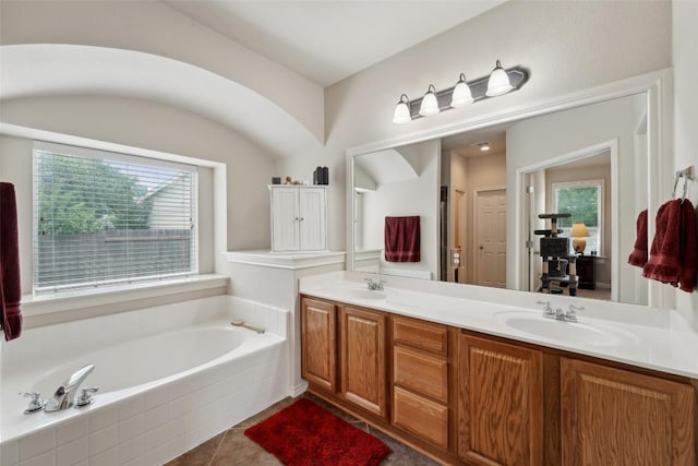 722 Tom Kite Dr, Round Rock, TX 78664 - full bathroom with a bath, double vanity, and tile patterned floors