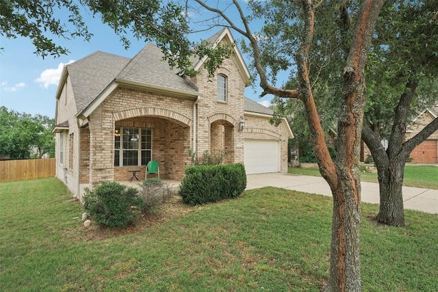 722 Tom Kite Dr, Round Rock, TX 78664 - view of front of home with driveway, brick siding, a shingled roof, a garage, and stone siding
