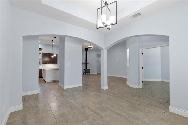 127 Medlar Dr, Cedar Creek, TX 78612 - unfurnished room with arched walkways and a chandelier