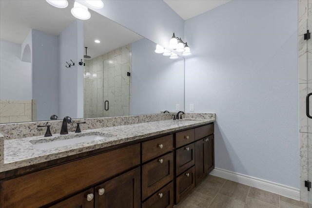 127 Medlar Dr, Cedar Creek, TX 78612 - bathroom with double vanity, baseboards, a shower stall, and tile patterned flooring