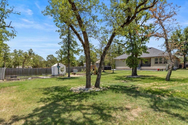 127 Medlar Dr, Cedar Creek, TX 78612 - fenced backyard featuring a storage unit