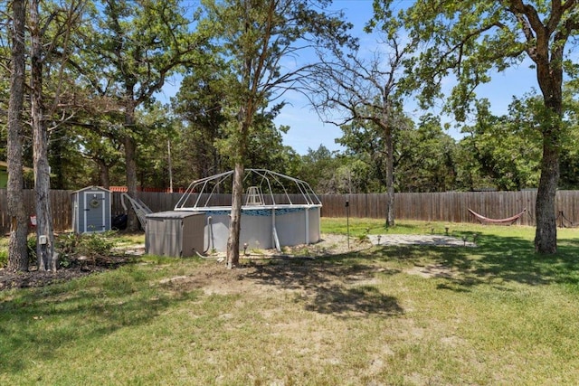 127 Medlar Dr, Cedar Creek, TX 78612 - fenced backyard with a storage unit