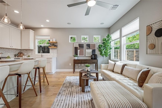 5512 Duval St Unit 2, Austin, TX 78751 - living room with light wood-type flooring, recessed lighting, and a ceiling fan