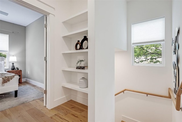 5512 Duval St Unit 2, Austin, TX 78751 - corridor with wood finished floors, built in features, healthy amount of natural light, and baseboards