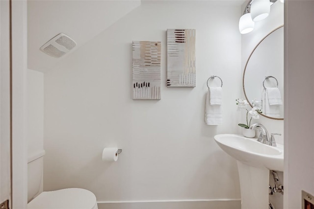 5512 Duval St Unit 2, Austin, TX 78751 - half bath featuring toilet, baseboards, and lofted ceiling