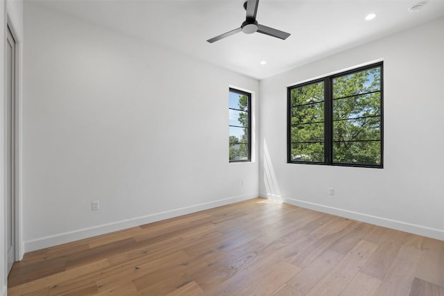 5218 Valley Oak Dr, Austin, TX 78731 - unfurnished room featuring light wood-style floors, recessed lighting, ceiling fan, and a smoke detector