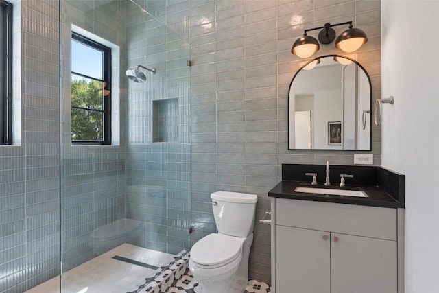 5218 Valley Oak Dr, Austin, TX 78731 - bathroom featuring a walk in shower, vanity, and tile walls